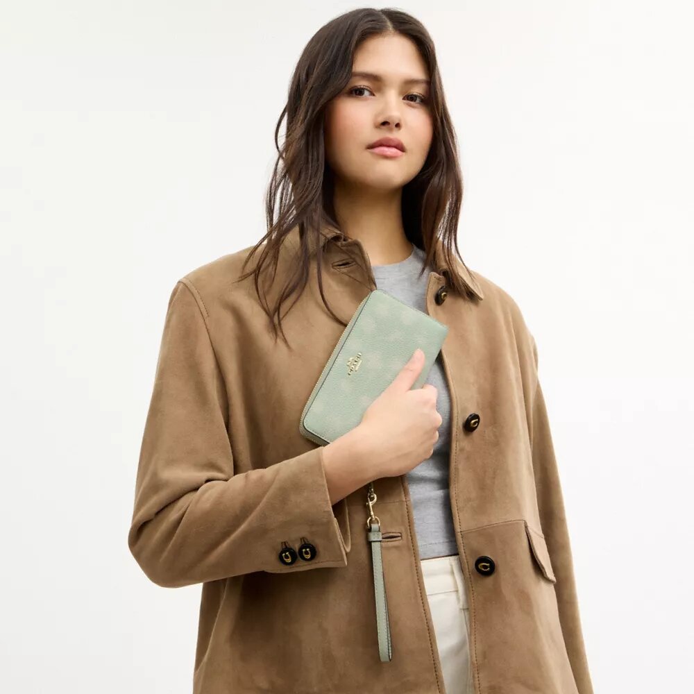 Cartera larga con cierre de cremallera alrededor y estampado floral