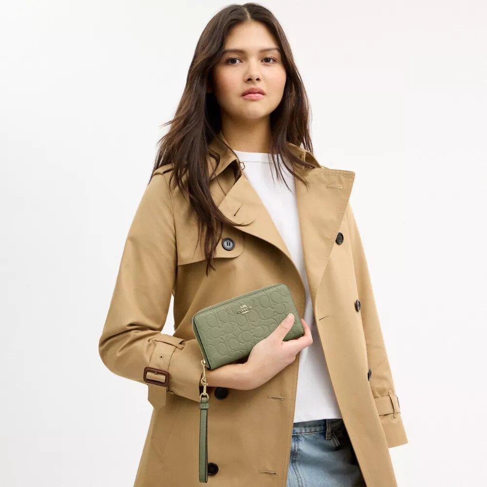 Cartera larga con cremallera alrededor en cuero exclusivo