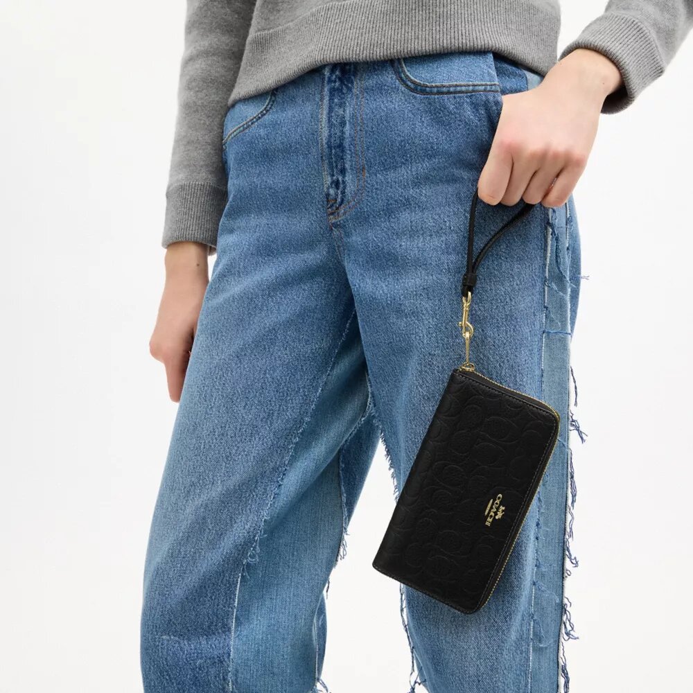 Cartera larga con cremallera alrededor en cuero exclusivo