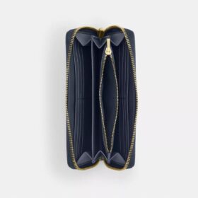 Cartera larga con cremallera alrededor en denim exclusivo