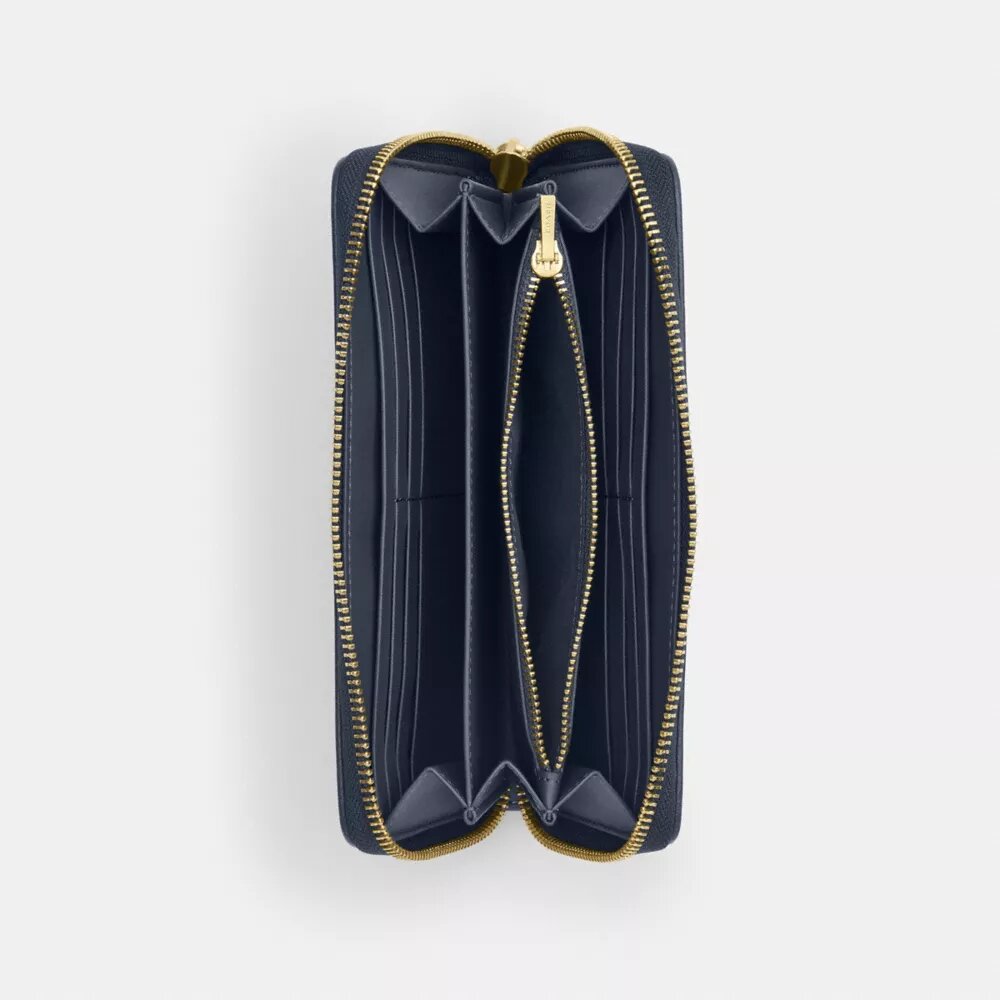 Cartera larga con cremallera alrededor en denim exclusivo