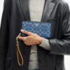 Cartera larga con cremallera alrededor en denim exclusivo