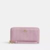 Cartera larga con cremallera alrededor y acolchado