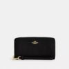 Cartera larga con cremallera alrededor y acolchado