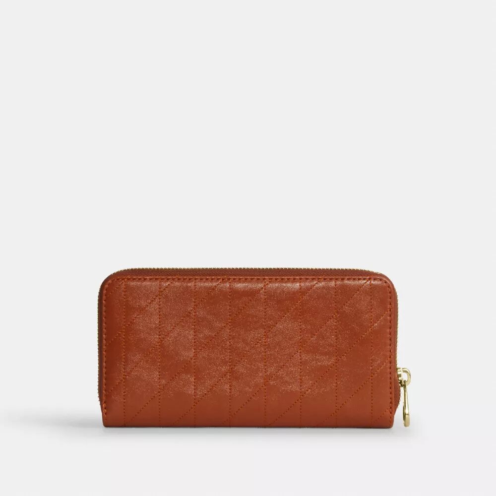 Cartera larga con cremallera alrededor y acolchado