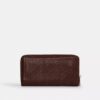 Cartera larga con cremallera alrededor y acolchado