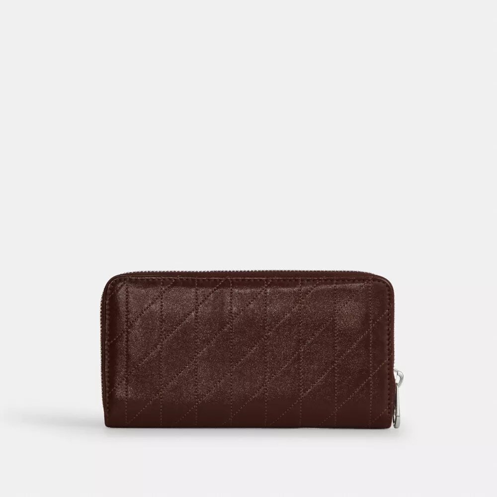 Cartera larga con cremallera alrededor y acolchado