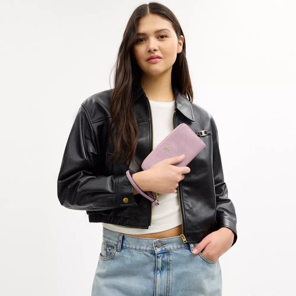 Cartera larga con cremallera alrededor y acolchado
