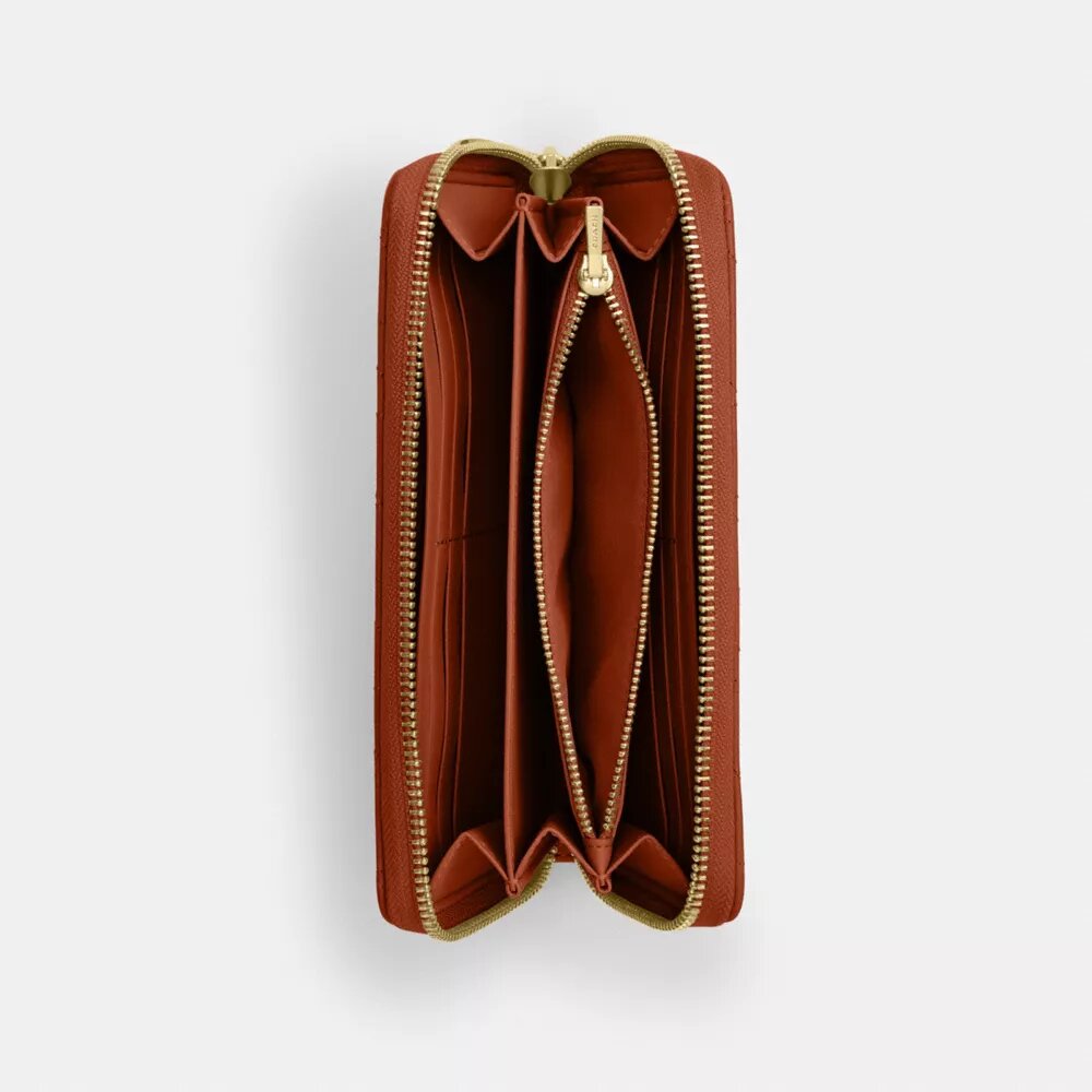 Cartera larga con cremallera alrededor y acolchado