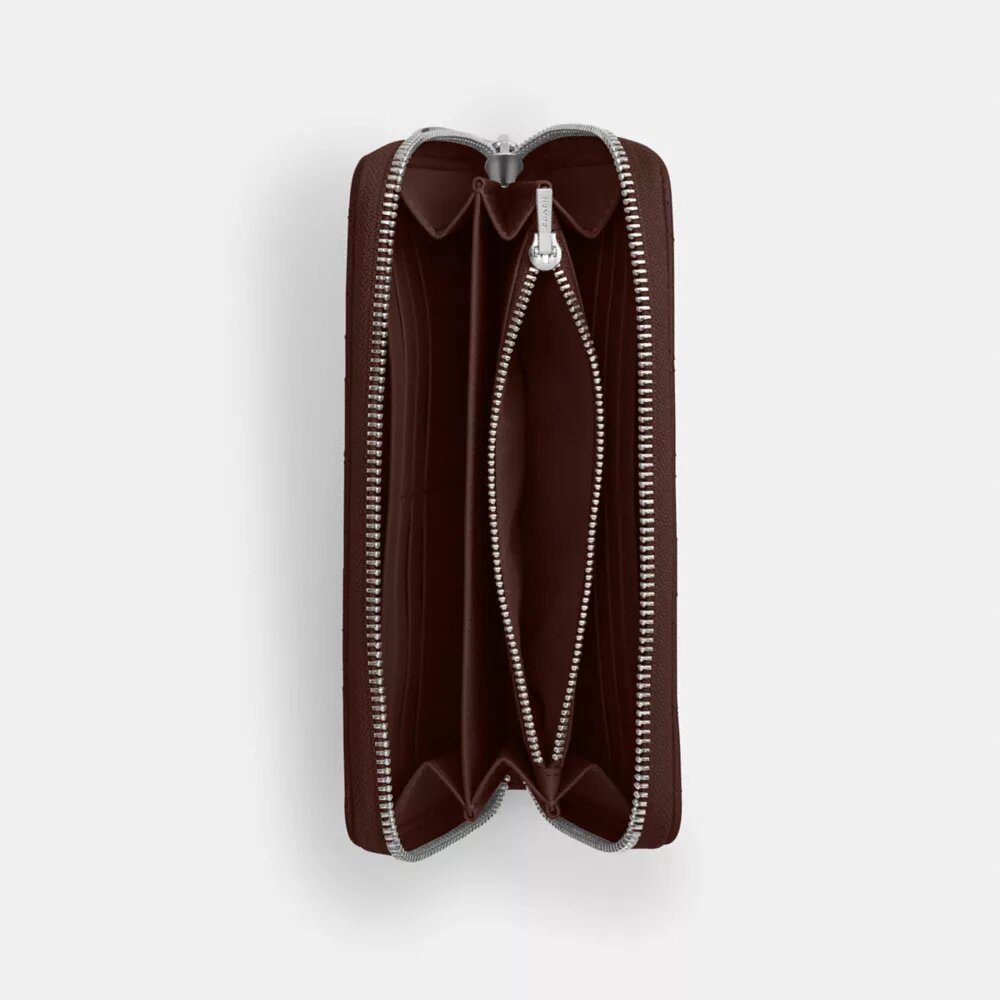 Cartera larga con cremallera alrededor y acolchado