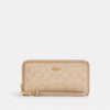 Cartera larga con cremallera alrededor y Signature Canvas