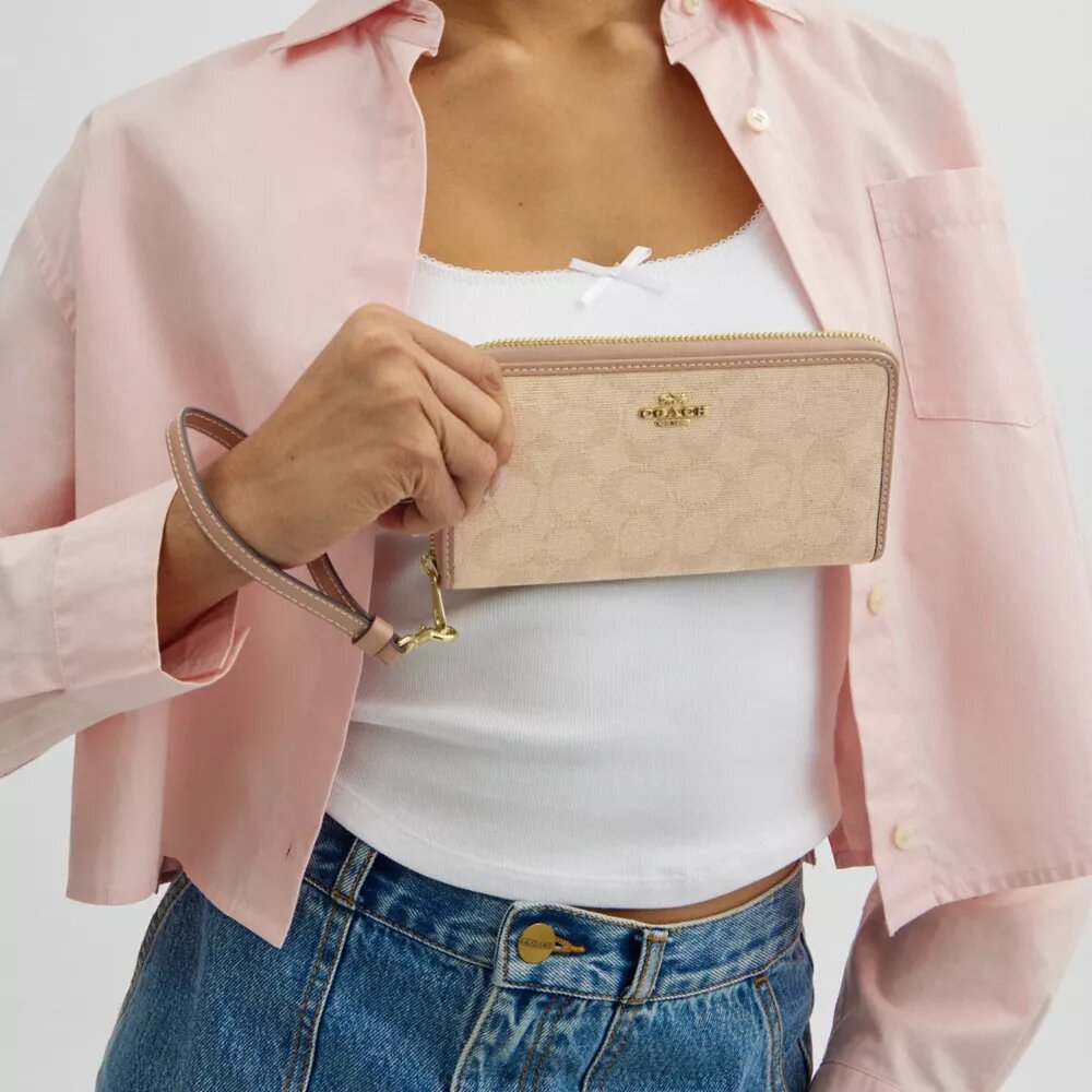 Cartera larga con cremallera alrededor y Signature Canvas
