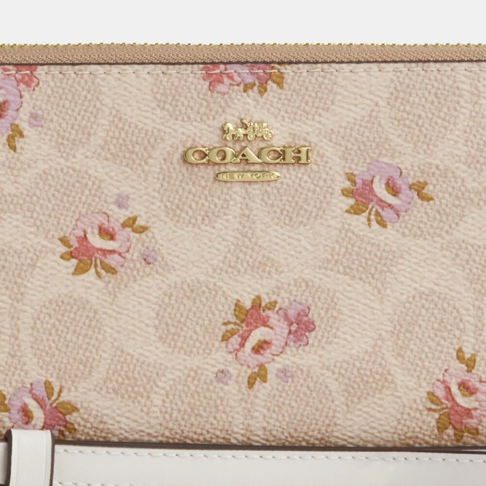 Cartera larga con cremallera envolvente en Signature Canvas con estampado floral