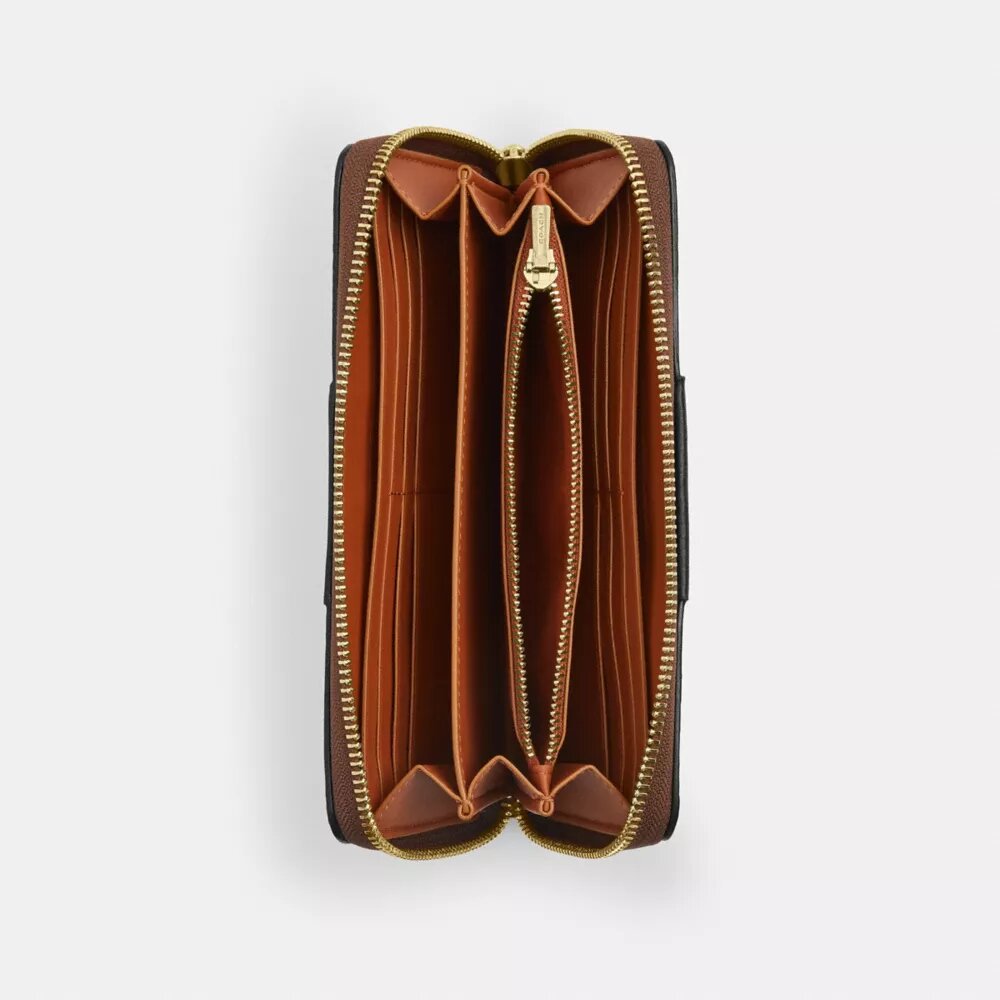 Cartera larga con cremallera envolvente en Signature Canvas con rayas