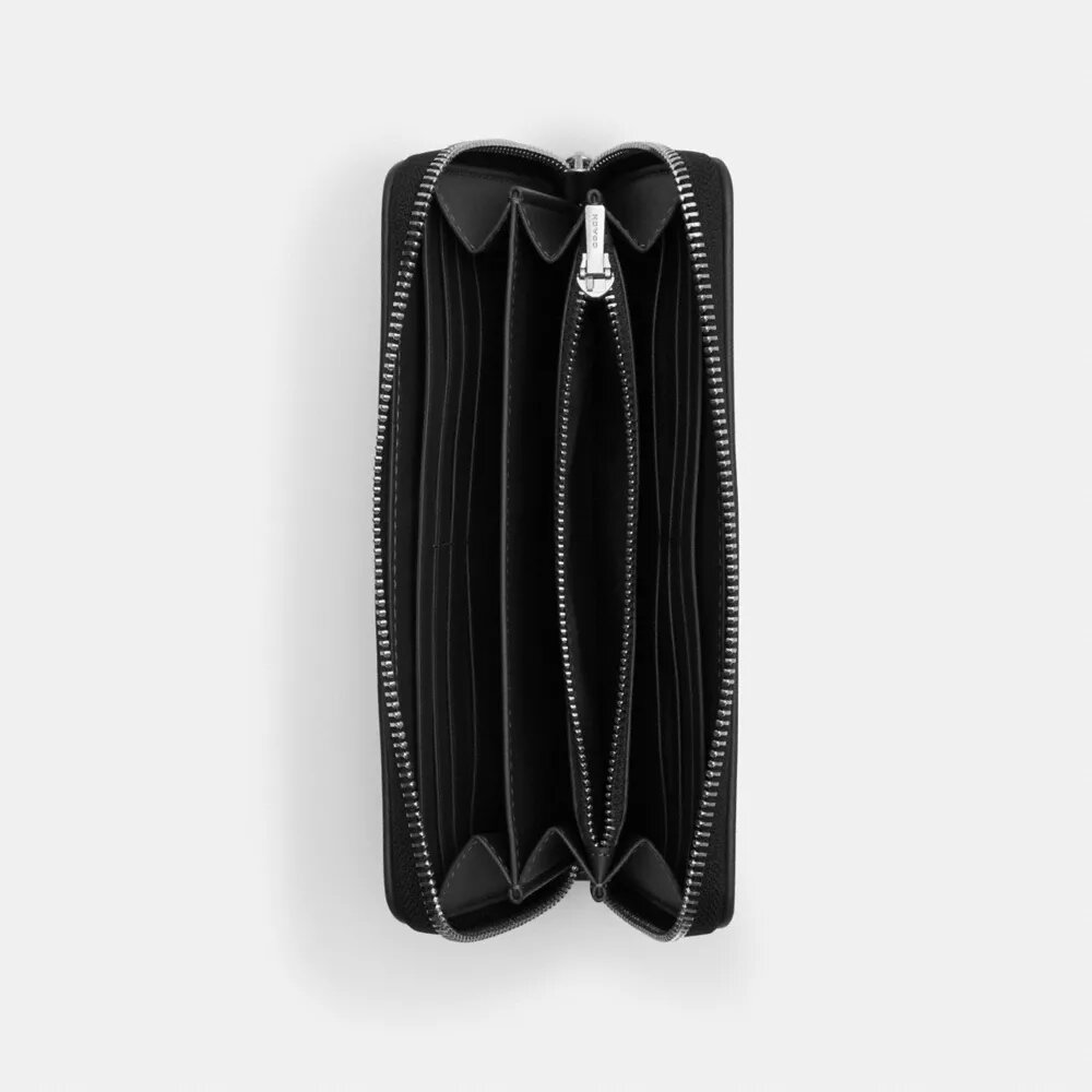 Cartera larga con cremallera perimetral en jacquard exclusivo