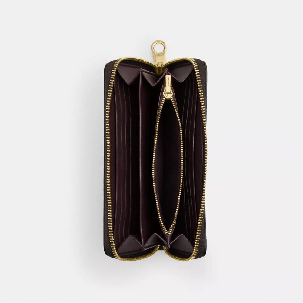 Cartera larga con cremallera perimetral en Signature Canvas