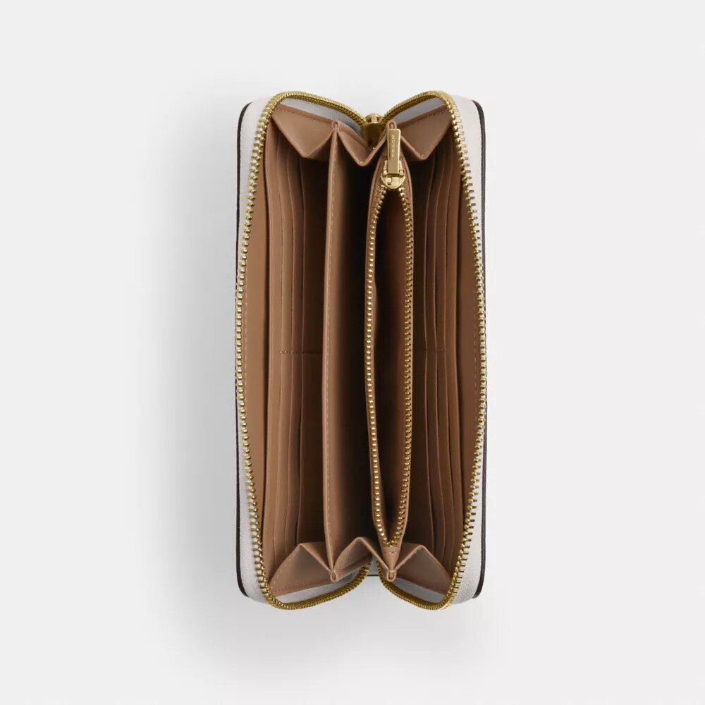 Cartera larga con cremallera perimetral en Signature Canvas