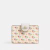 Cartera mediana con cremallera en la esquina y estampado floral