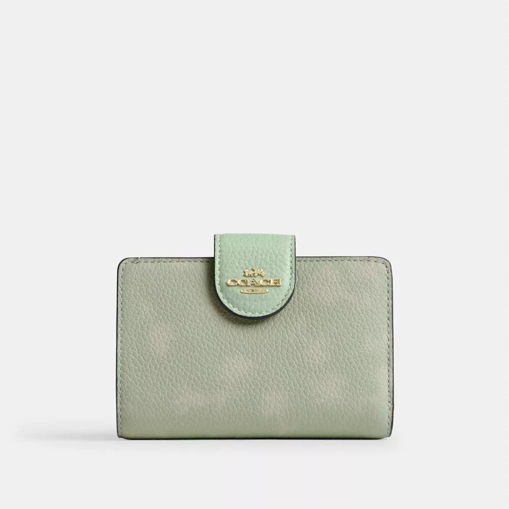 Cartera mediana con cremallera en la esquina y estampado floral