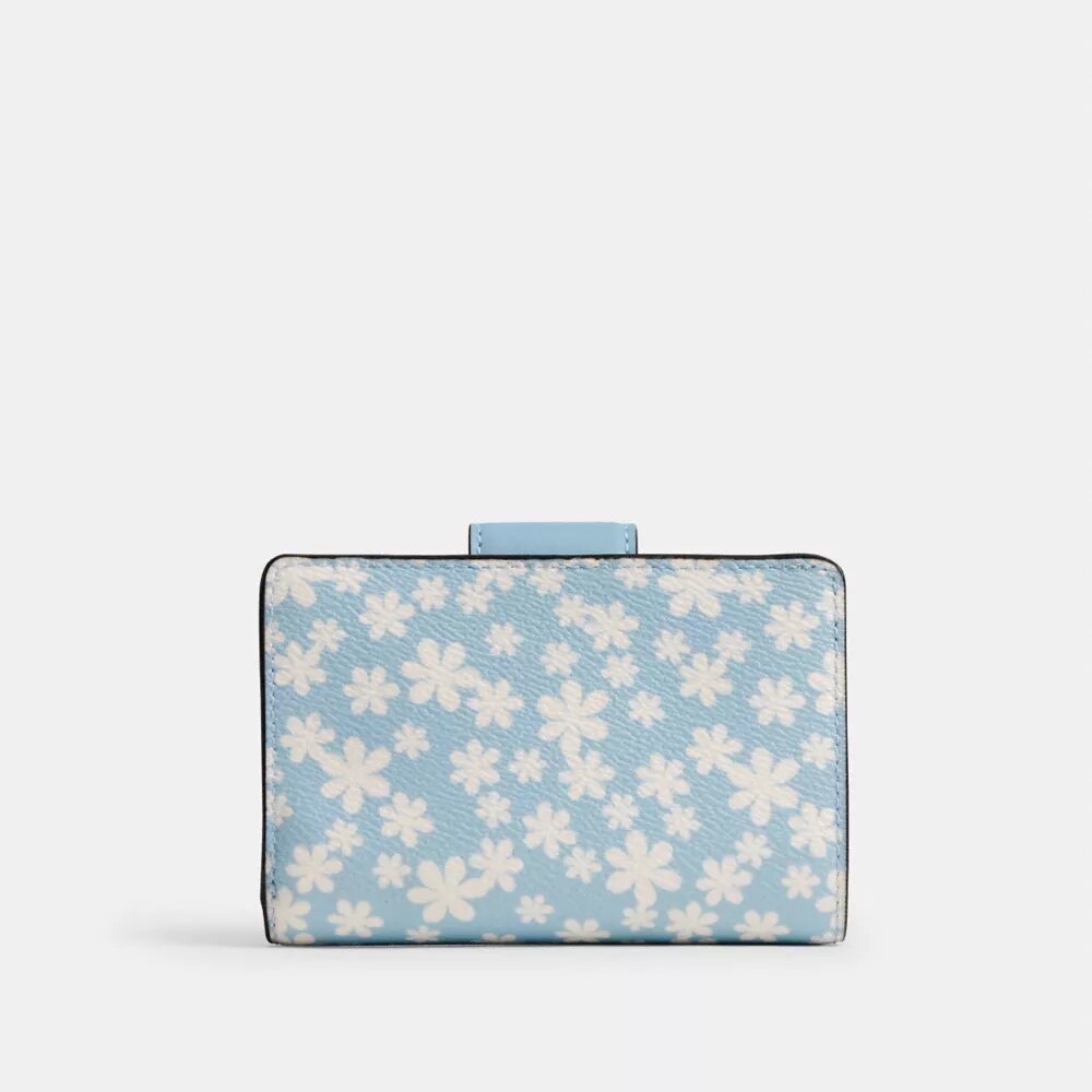 Cartera mediana con cremallera en la esquina y estampado floral