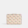 Cartera mediana con cremallera en la esquina y estampado floral