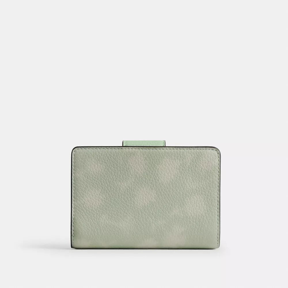 Cartera mediana con cremallera en la esquina y estampado floral