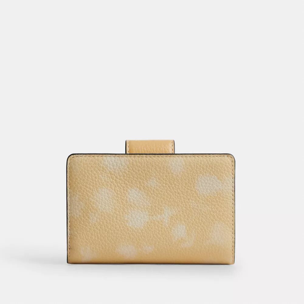Cartera mediana con cremallera en la esquina y estampado floral