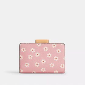 Cartera mediana con cremallera en la esquina y estampado floral