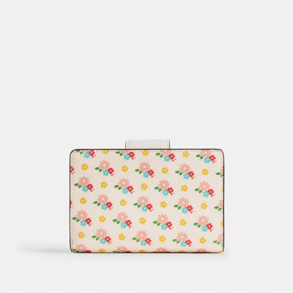 Cartera mediana con cremallera en la esquina y estampado floral