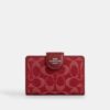 Cartera mediana con cremallera en las esquinas en denim exclusivo