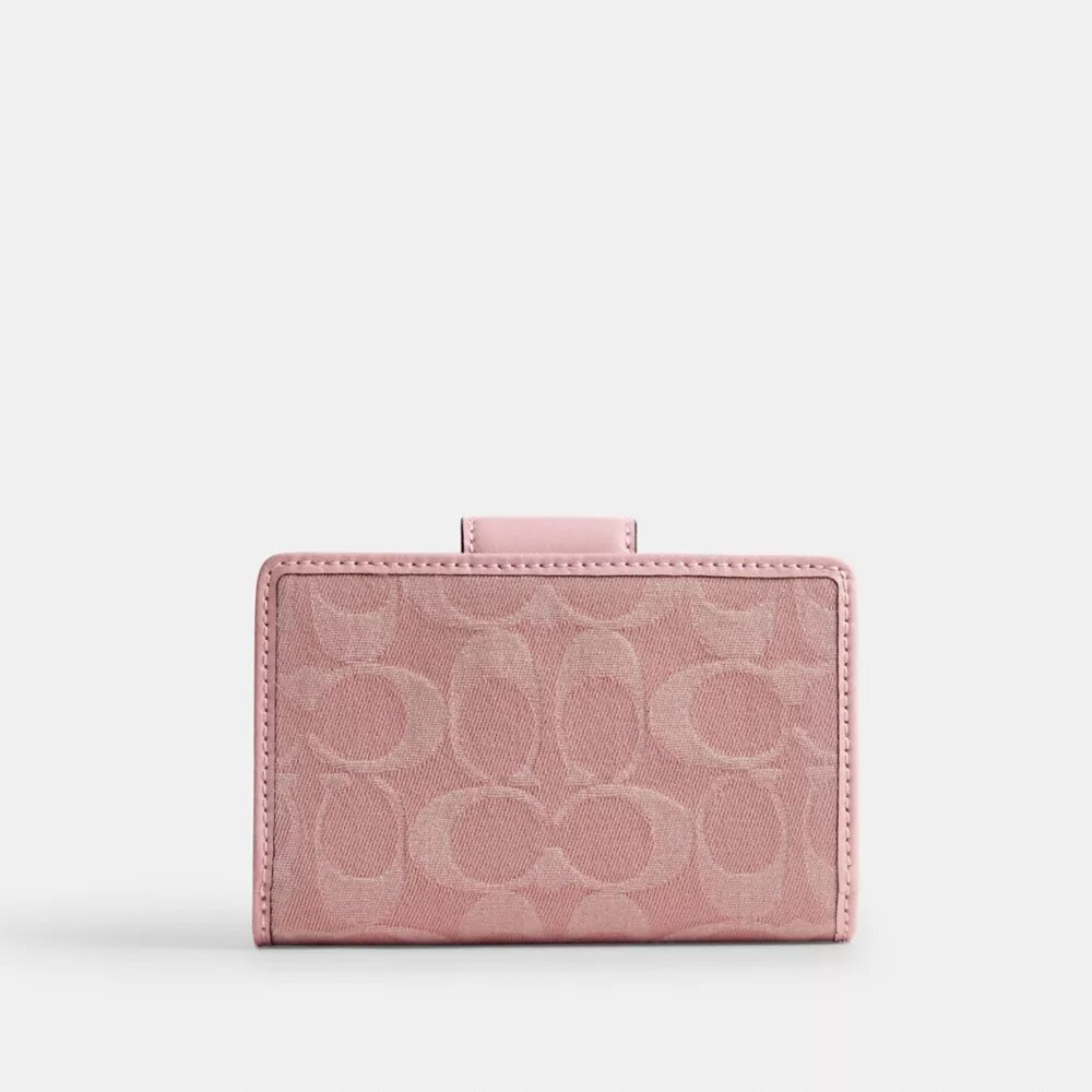Cartera mediana con cremallera en las esquinas en denim exclusivo