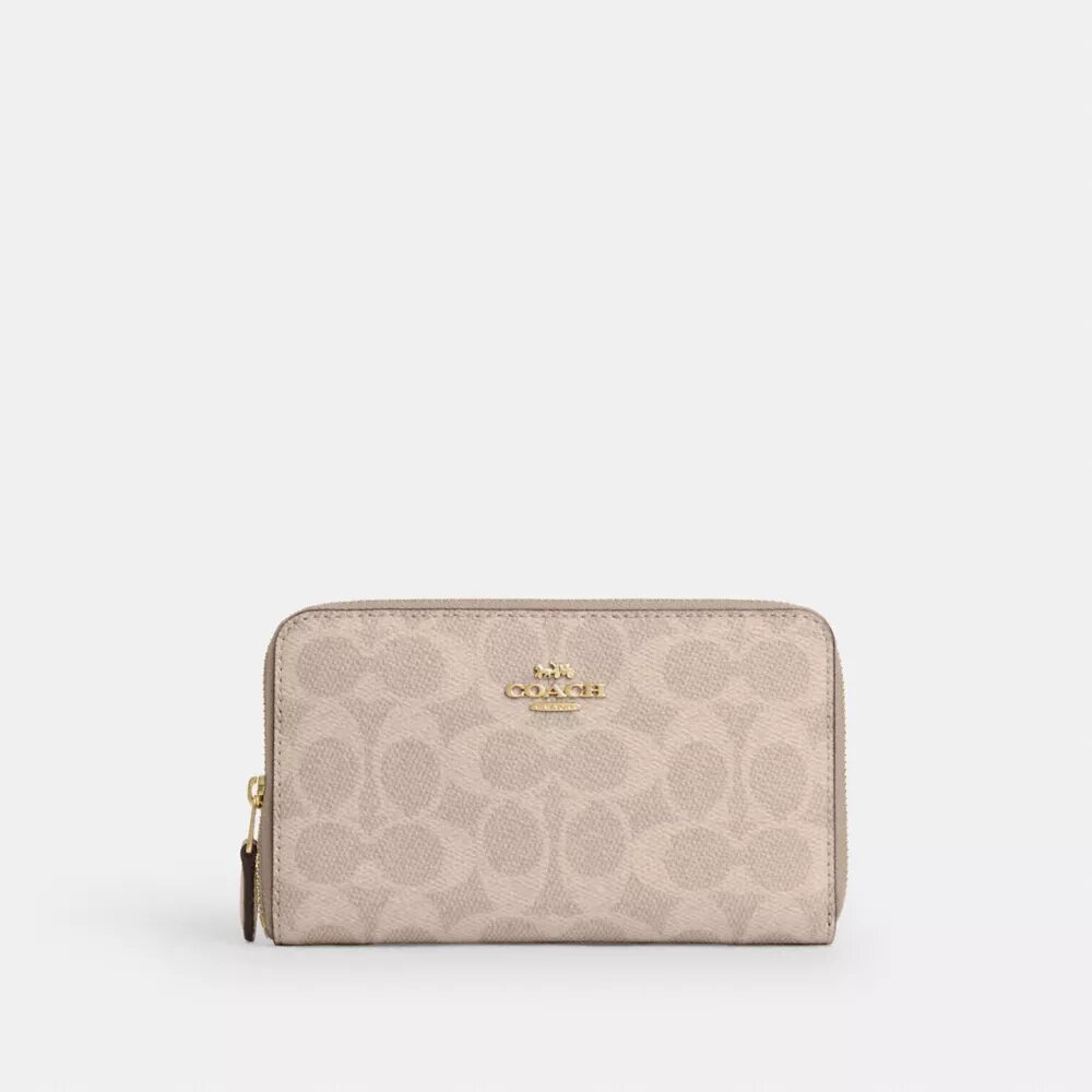 Cartera mediana con cremallera para identificaciones en Signature Canvas