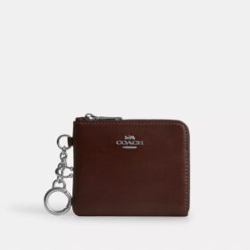 Cartera pequeña con cremallera en la esquina