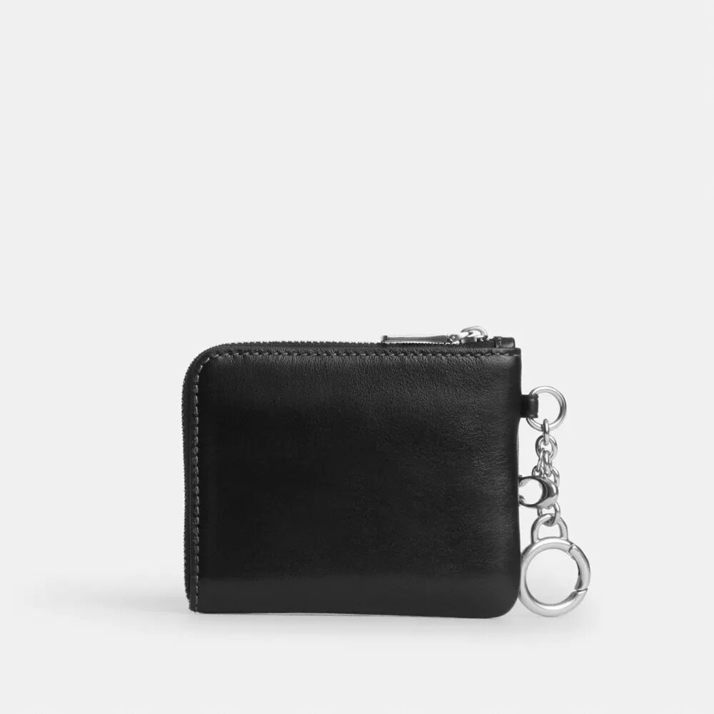 Cartera pequeña con cremallera en la esquina