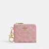 Cartera pequeña con cremallera en las esquinas, en denim exclusivo con Charms