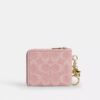 Cartera pequeña con cremallera en las esquinas, en denim exclusivo con Charms