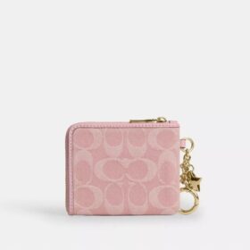 Cartera pequeña con cremallera en las esquinas, en denim exclusivo con Charms
