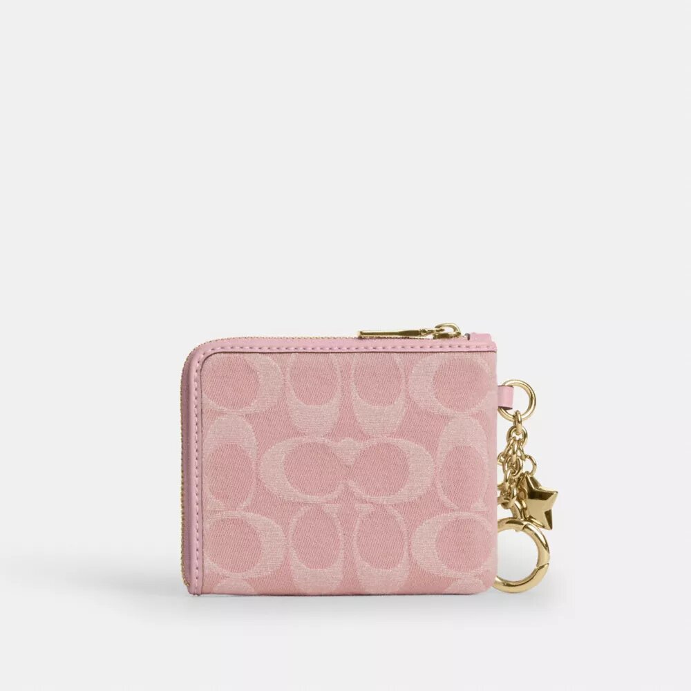 Cartera pequeña con cremallera en las esquinas, en denim exclusivo con Charms