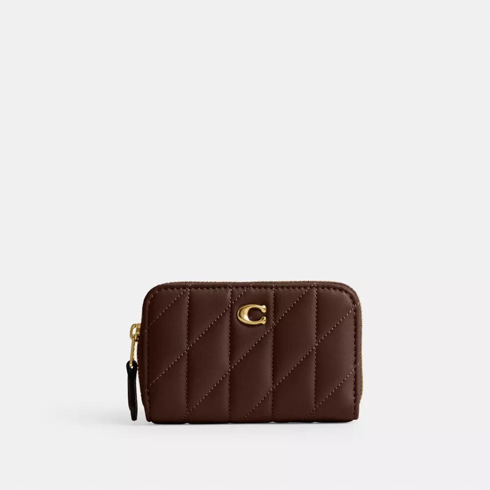 Cartera pequeña esencial con cierre de cremallera y acolchado tipo almohada