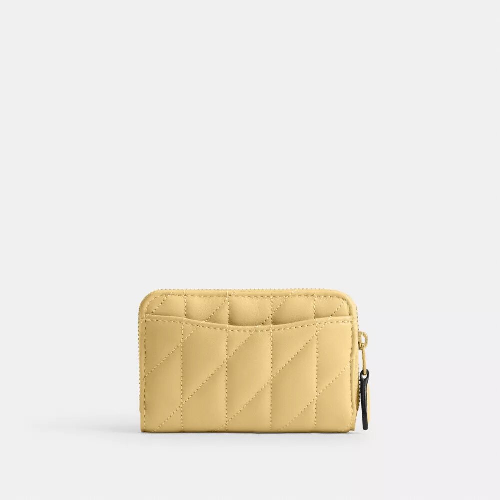 Cartera pequeña esencial con cierre de cremallera y acolchado tipo almohada