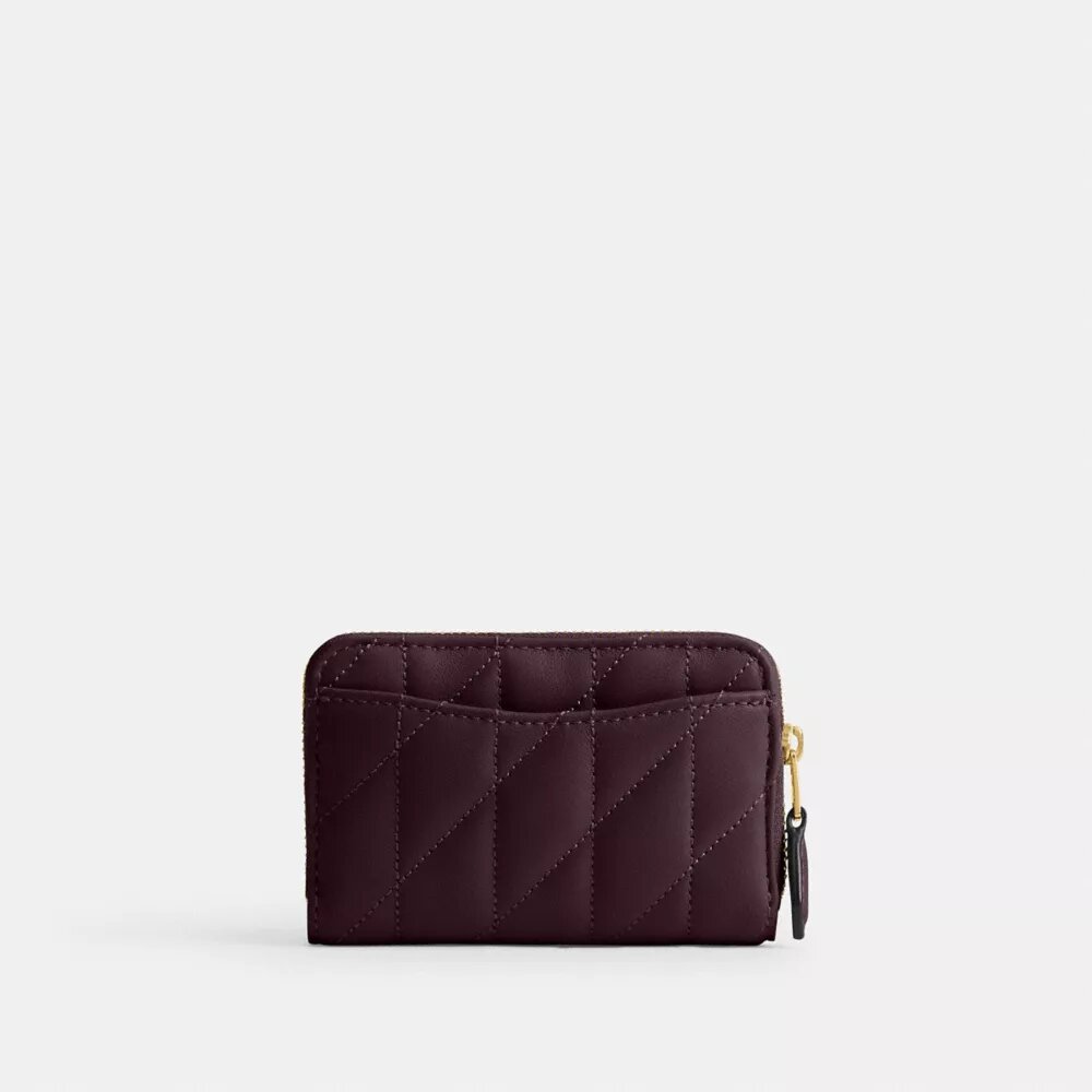 Cartera pequeña esencial con cierre de cremallera y acolchado tipo almohada