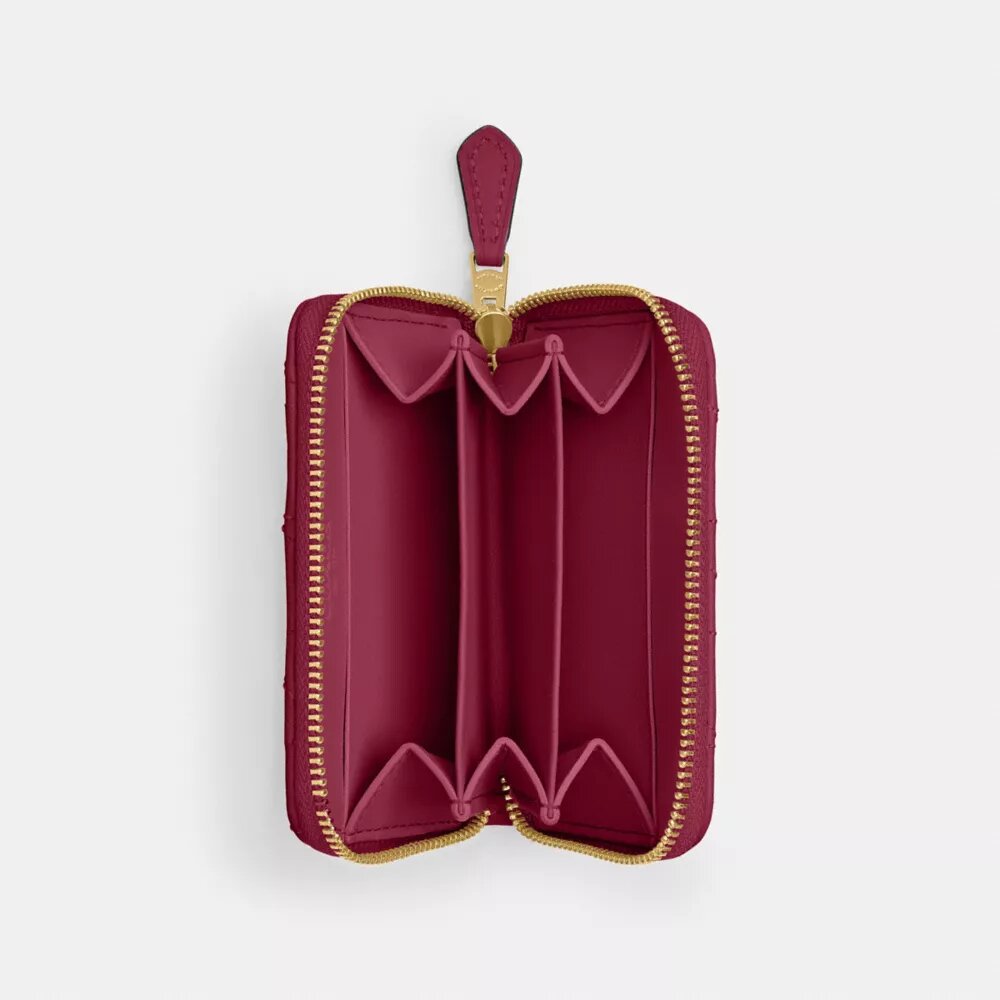 Cartera pequeña esencial con cierre de cremallera y acolchado tipo almohada