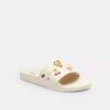 Chanclas deportivas Udele de Disney X Coach con estampado de calcomanías