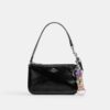 Colgante para bolsos con cierre de resorte y estampado floral