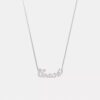 Collar con placa de nombre en letra cursiva Coach