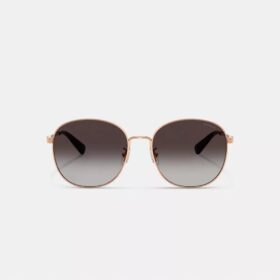 Gafas de sol redondas de metal con detalles en C