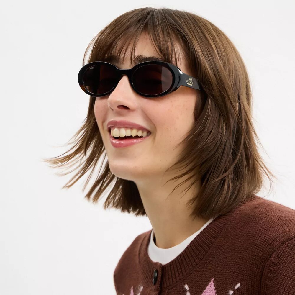 Lentes de sol ovalados estrechos
