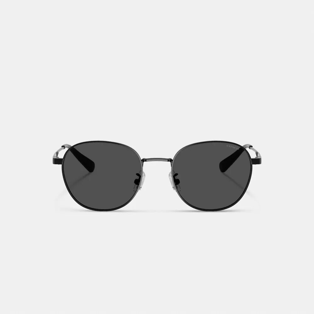 Lentes de sol redondas con etiqueta metálica