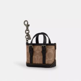 Mini colgante para bolsos Tote Warner en Signature Canvas