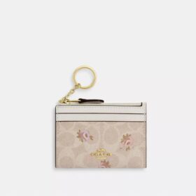 Mini estuche delgado para identificación en Signature Canvas con estampado floral